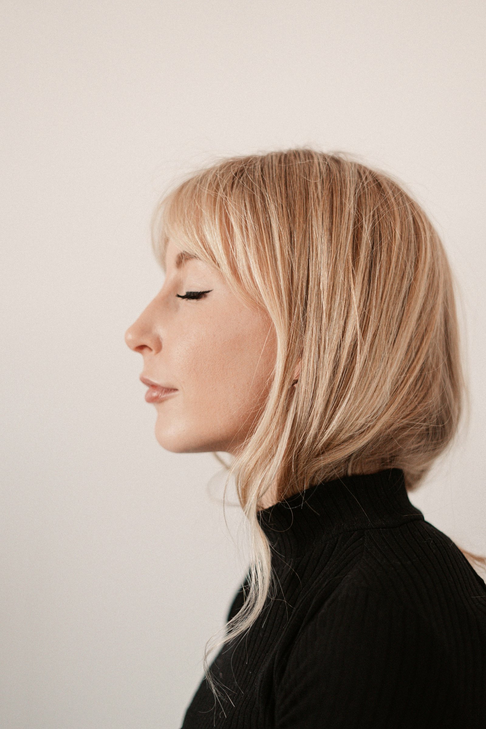 woman in black turtleneck shirt